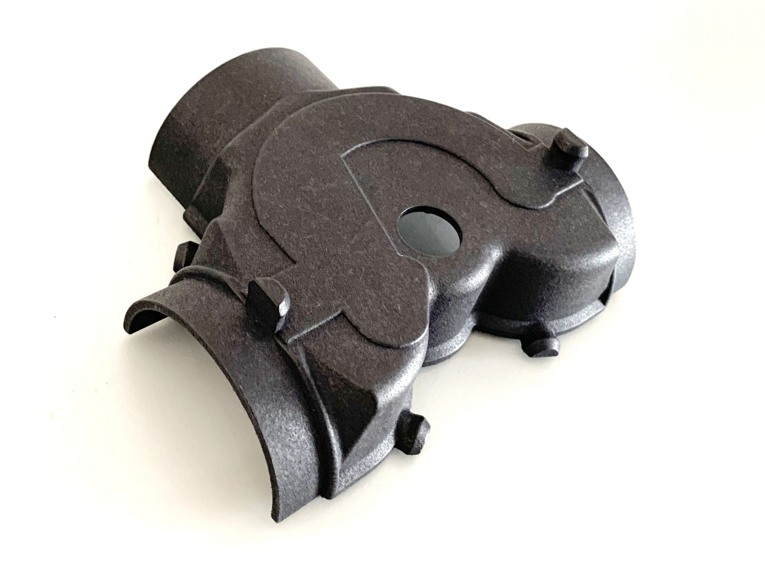 Part of the early Porsche 911 control box. The complex geometry and thin walls makes FDM printing difficult but powder based printers make short work of it.